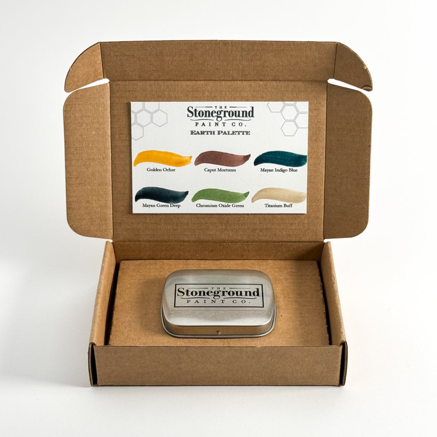 Stoneground Paint Co. "Earth Palette" 6pc Watercolor Set - Photo of packaging, including foldable box, hinged metal tin, & paint swatches. Mona Lisa Artists Materials Calgary Alberta